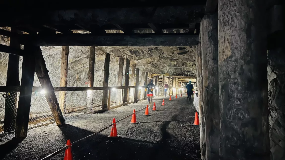 A racer runs through the Bellevue Underground Mine