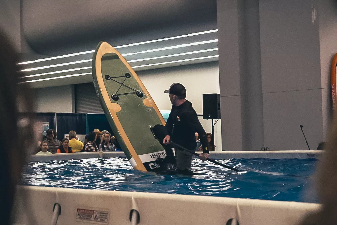 Yann Fortin performs freestyle SUP tricks at The Wild Tribe trade show 