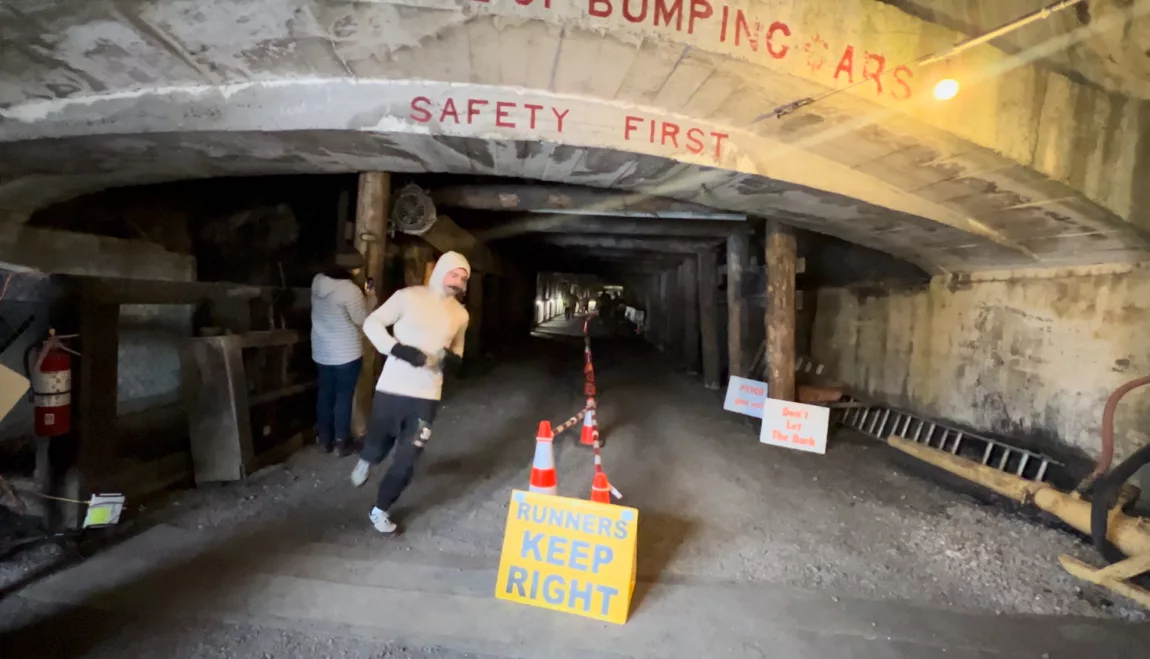 A runner completes a lap at The Dark, a race in the Bellevue Underground Mine