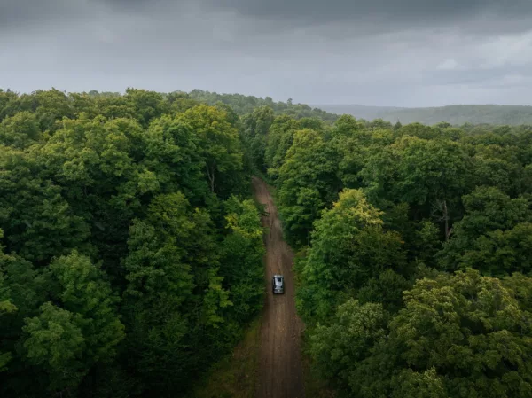 Beautiful overview of rustic Ontario car driving down road