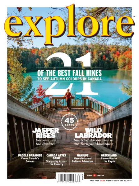 Fall 2026 Cover Explore Magazine Cover of Explore magazine fall 2026: a person on a wooden viewing deck overlooking a turquoise lake with autumn trees in the background and bold yellow'explore' title across the top.